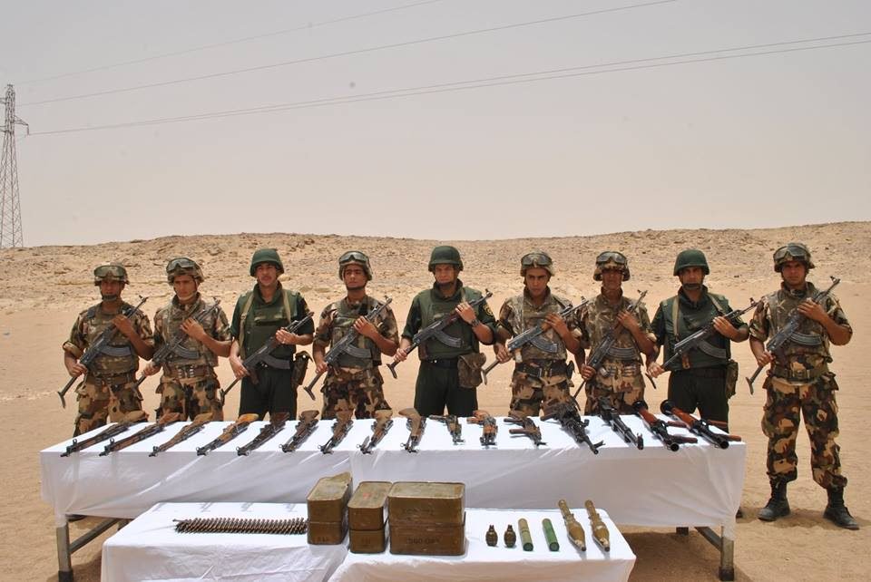 The Algerian soldiers with the seized weapons found with the terrorist