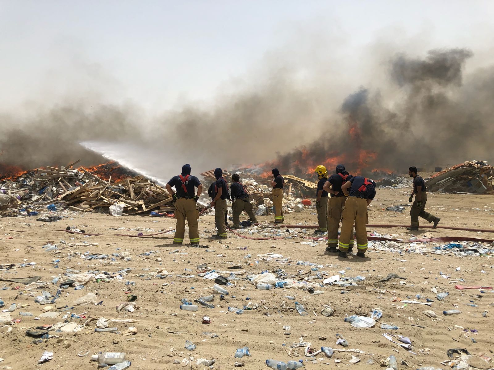 Teams of firefighters bring down the fire gutted a waste disposal plant in Western Mina Abdullah
