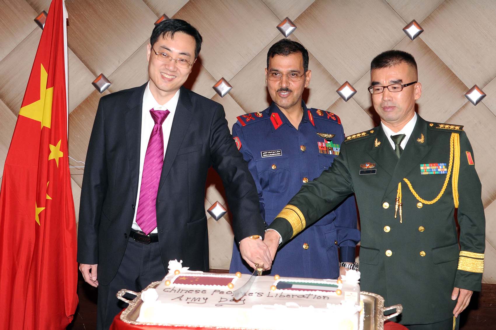 Air Comodore Adnan Al-Fadhli, Defence Attache of the Chinese Embassy Colonel Zhang Ge during the anniversary of the Chinese People's Liberation Army (PLA)