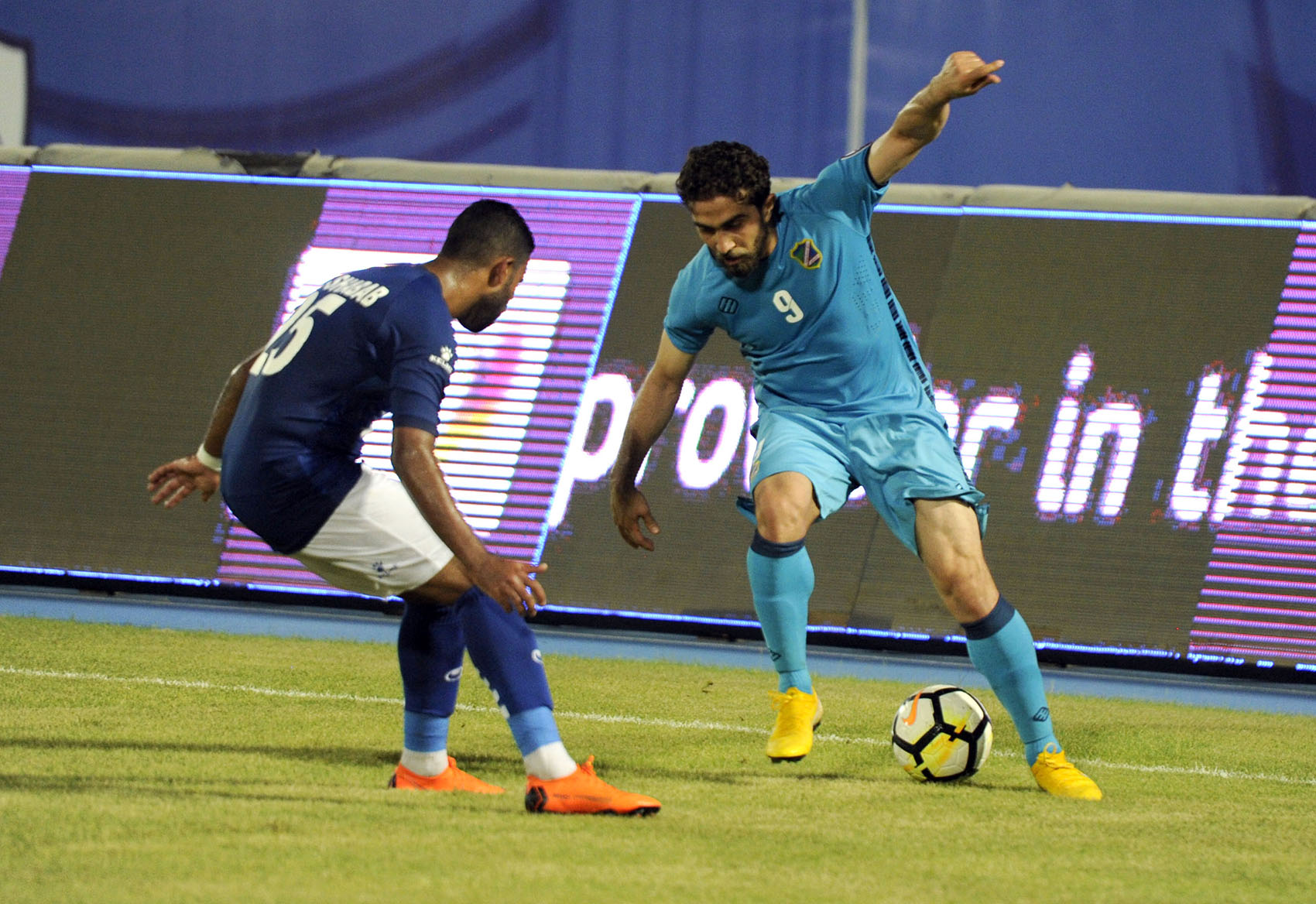 Salmiya player international Al-Khateeb attacks (Shabab) goal