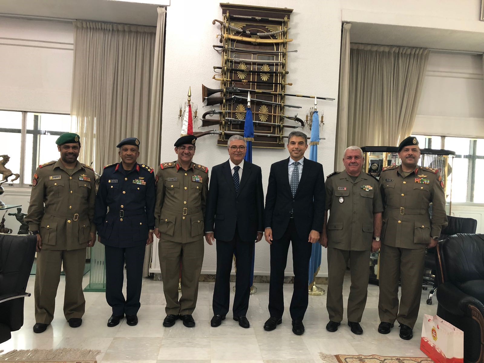 Tunisia's Defence Minister Abdelkarim Zbidi meets with a Kuwaiti official