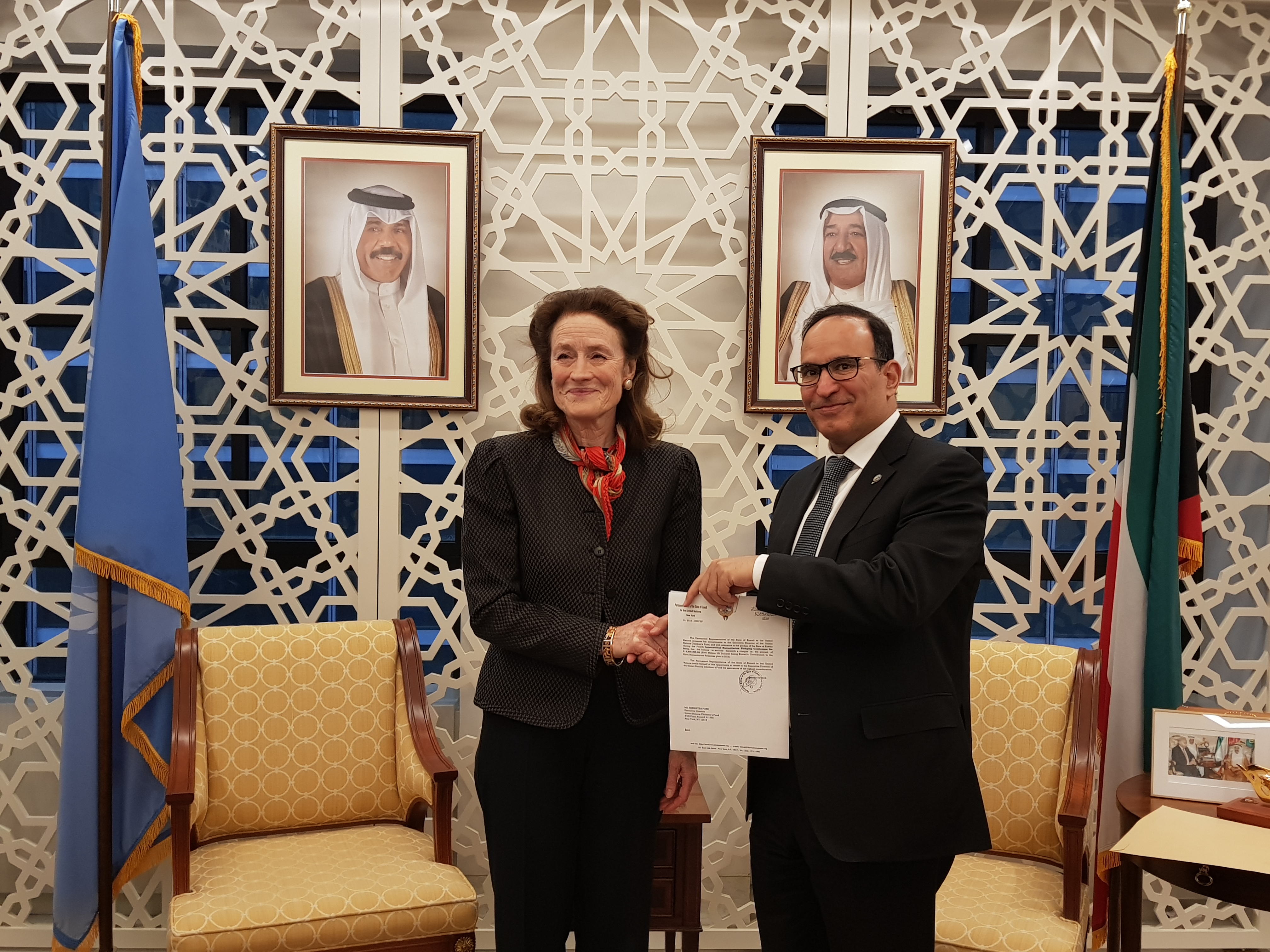 Kuwait's Permanent Representative to the United Nations, Ambassador Mansour Al-Otaibi handes over financial contributions from Kuwait