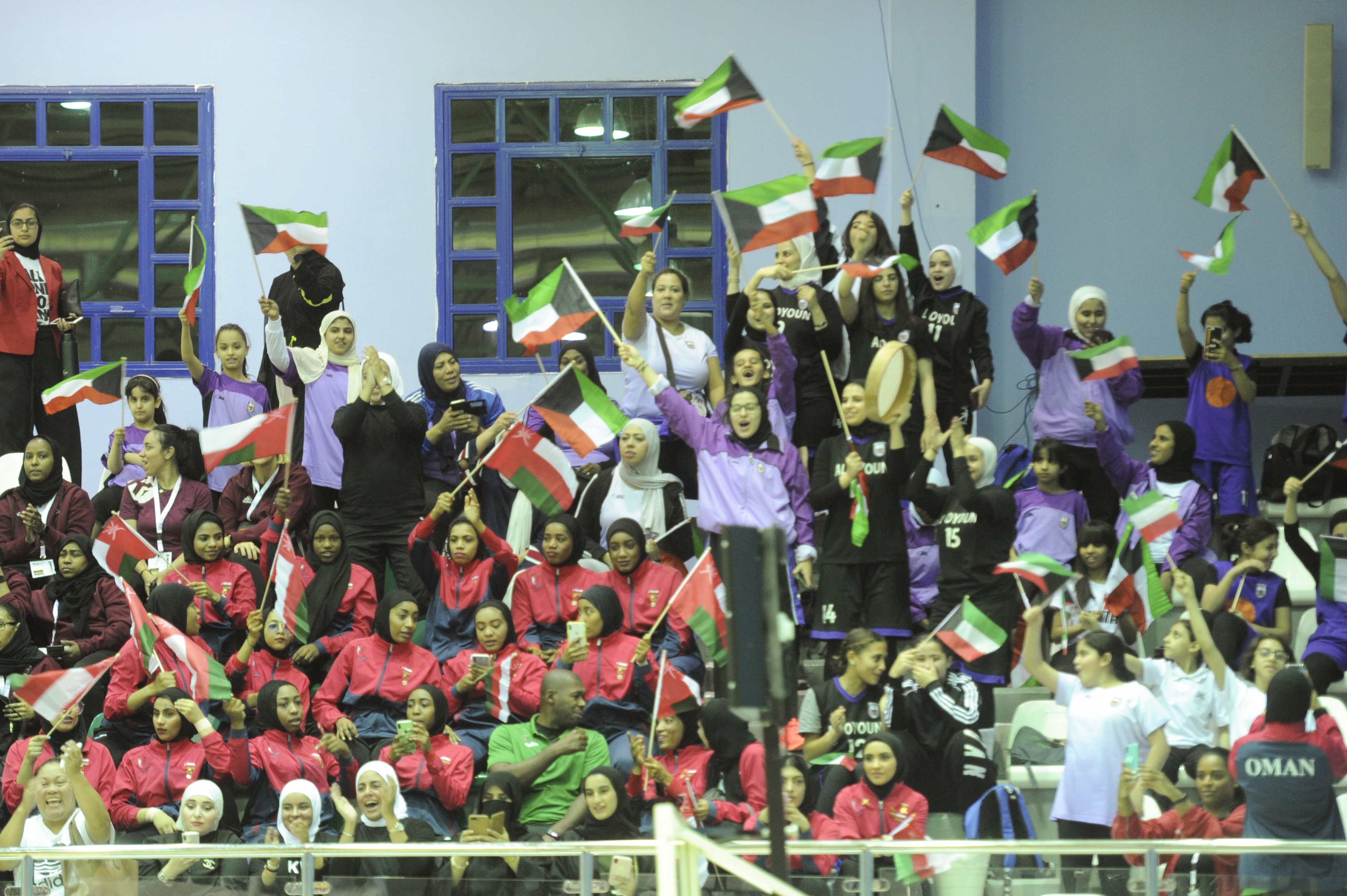 Cheering audience for the Kuwaiti and Omani teams