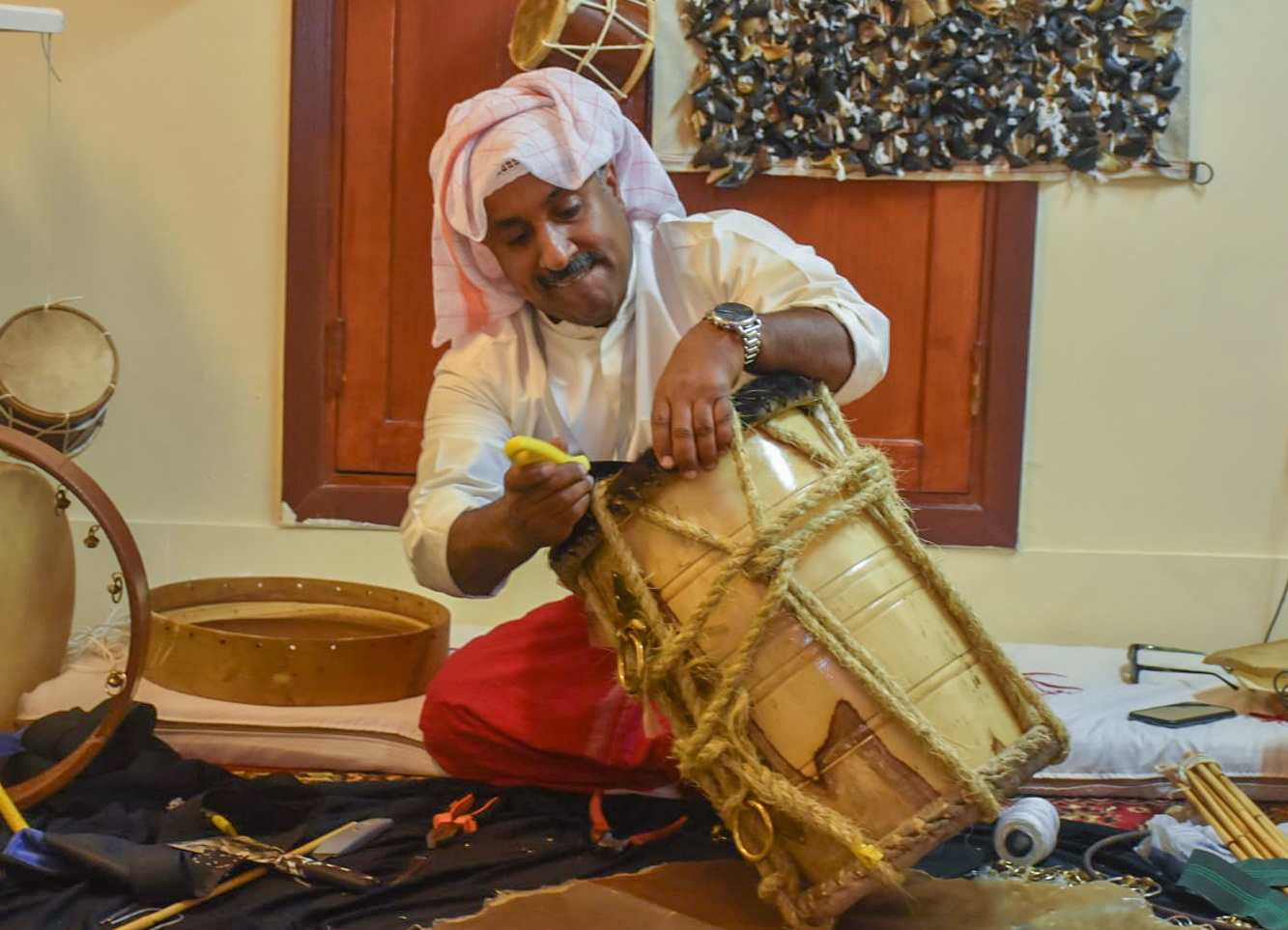Craftsman Talal Al-Asousi making traditional Kuwaiti drums