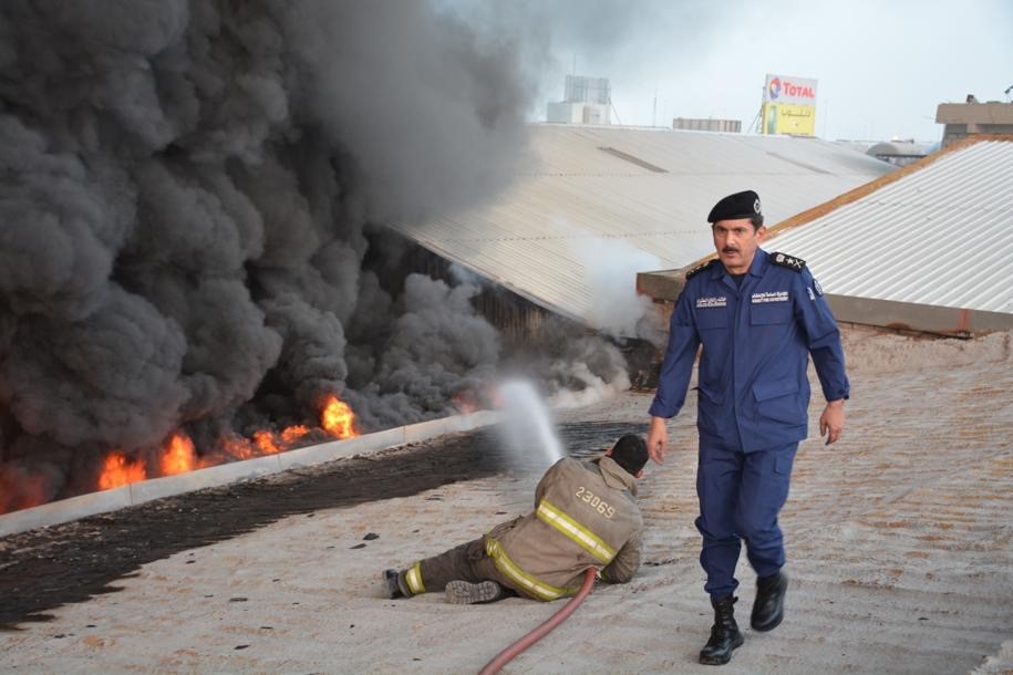 Firefighters put out the blaze that started in a warehouse in al Rai area
