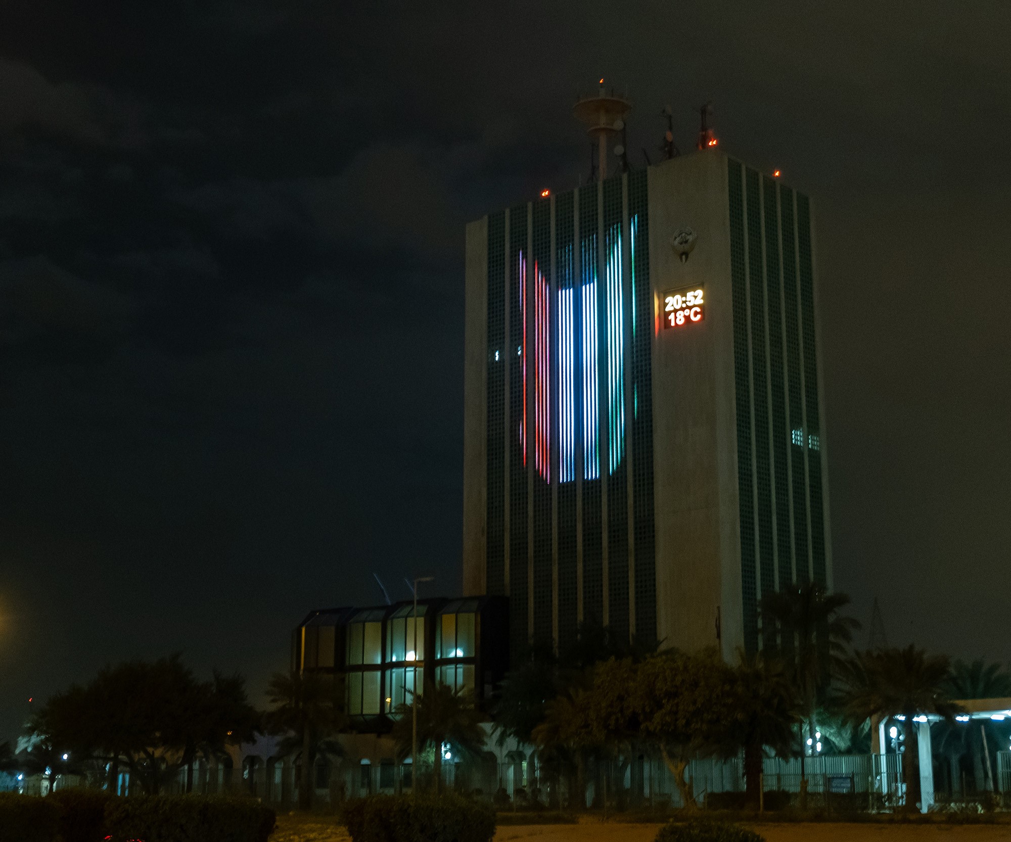 Colors of Kuwaiti flag adorns buildings and monuments