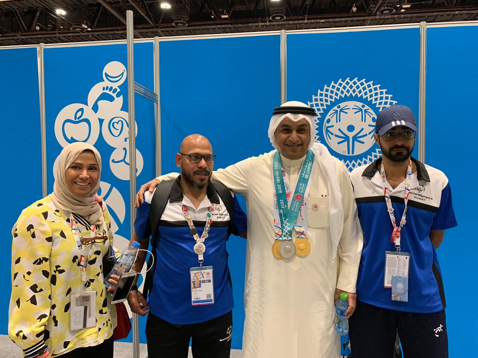 Nasser Aba Al-Khail, First Secretary at Kuwait Embassy to UAE, and Rehab Buresli, Kuwaiti National Special Olympics Director with Kuwait double team after winning silver in bowling event
