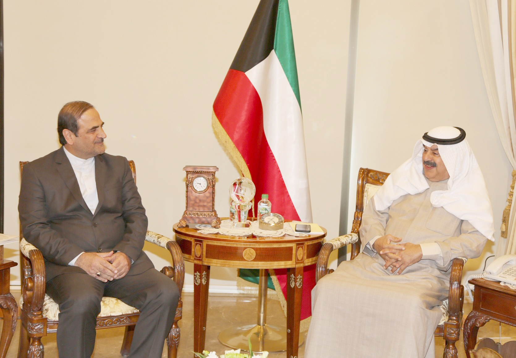 Kuwaiti Deputy Foreign Minister Khaled Al-Jarallah with the new Iranian Ambassador to Kuwait Mohammad Irani