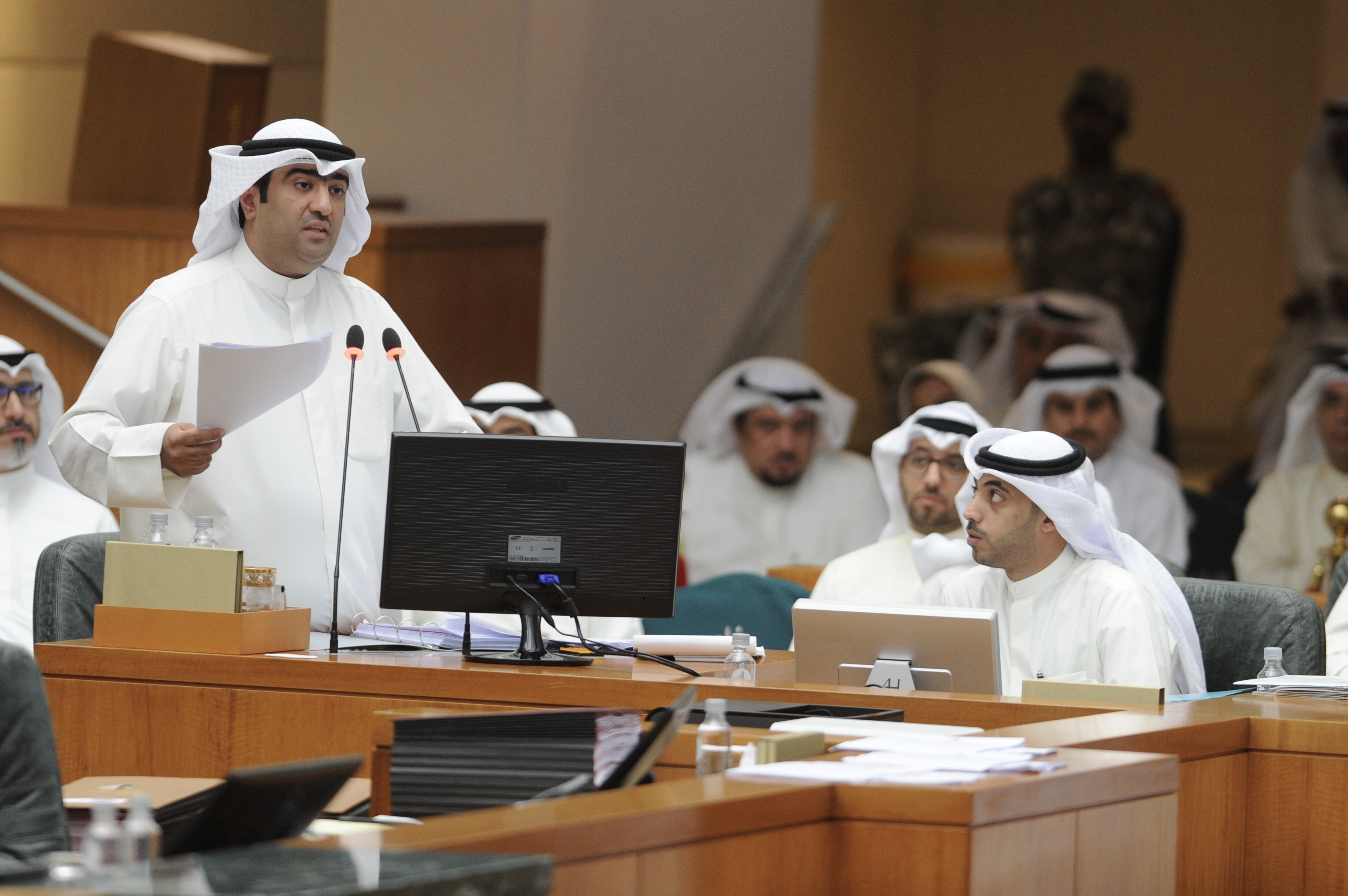 Minister of Commerce Khaled Al-Roudhan replies to MPs' questions during parliament grilling session