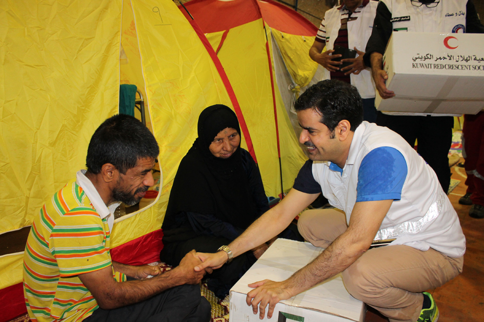 KUNA Iranians Kuwaiti humanitarian shipment for flood victims
