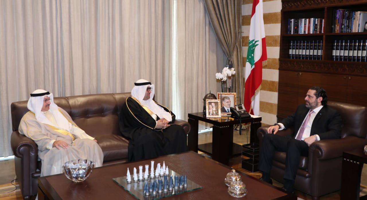 Lebanon's Prime Minister Saad Al-Hariri with Kuwaiti Minister of Commerce and Industry Khaled Al-Roudhan accompanied by Kuwait's ambassador to Lebanon Abdel-Al Al-Qena'i