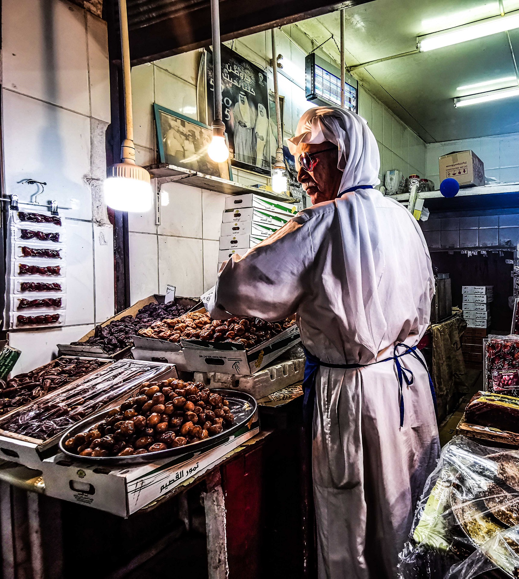 Dates vendor arranges the goods	in his shop