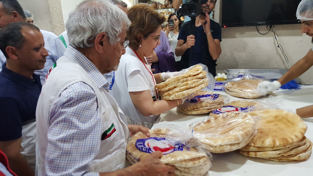 (KRCS) distribute bread for the refugees