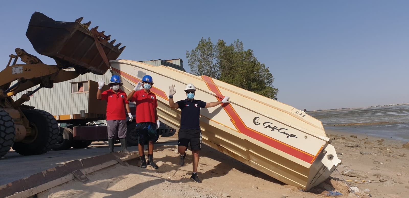 Kuwait Diving Team brought to surface a sunken boat weighing three tons from Oshairej shores