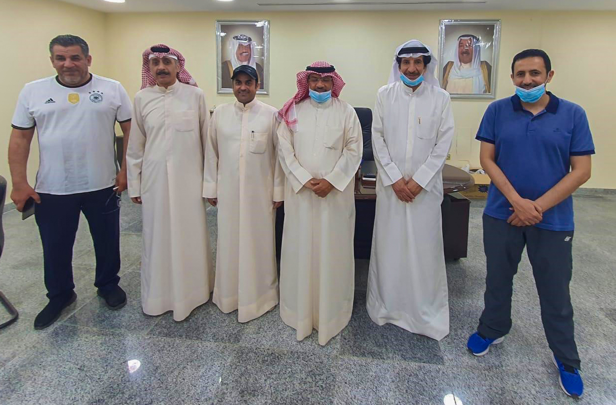 Group photo of the head of the association Sayar Al-Enezi, and  members of the council
