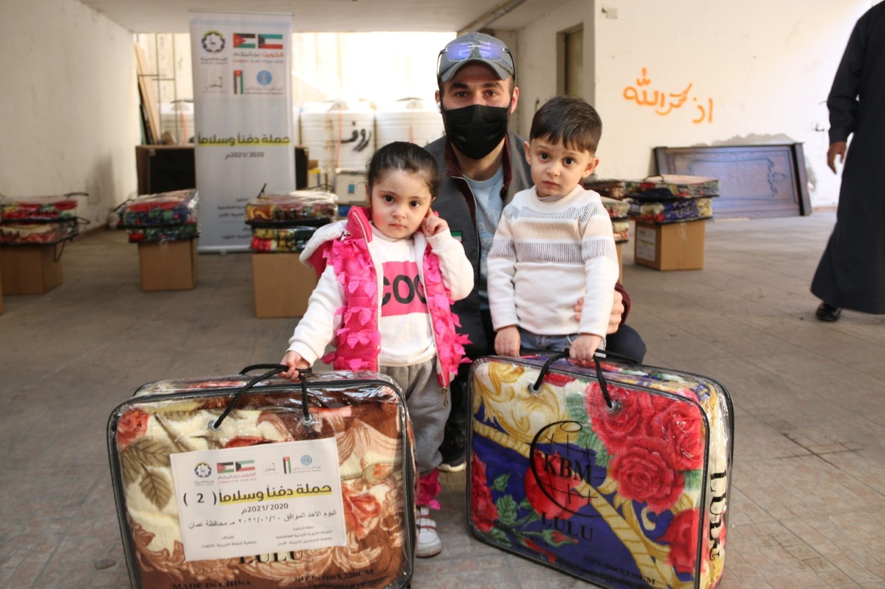  Kuwait Al-Najat Charity distributed relief aid to Syrian refugees in Jordan as part of the part of the warming campaign