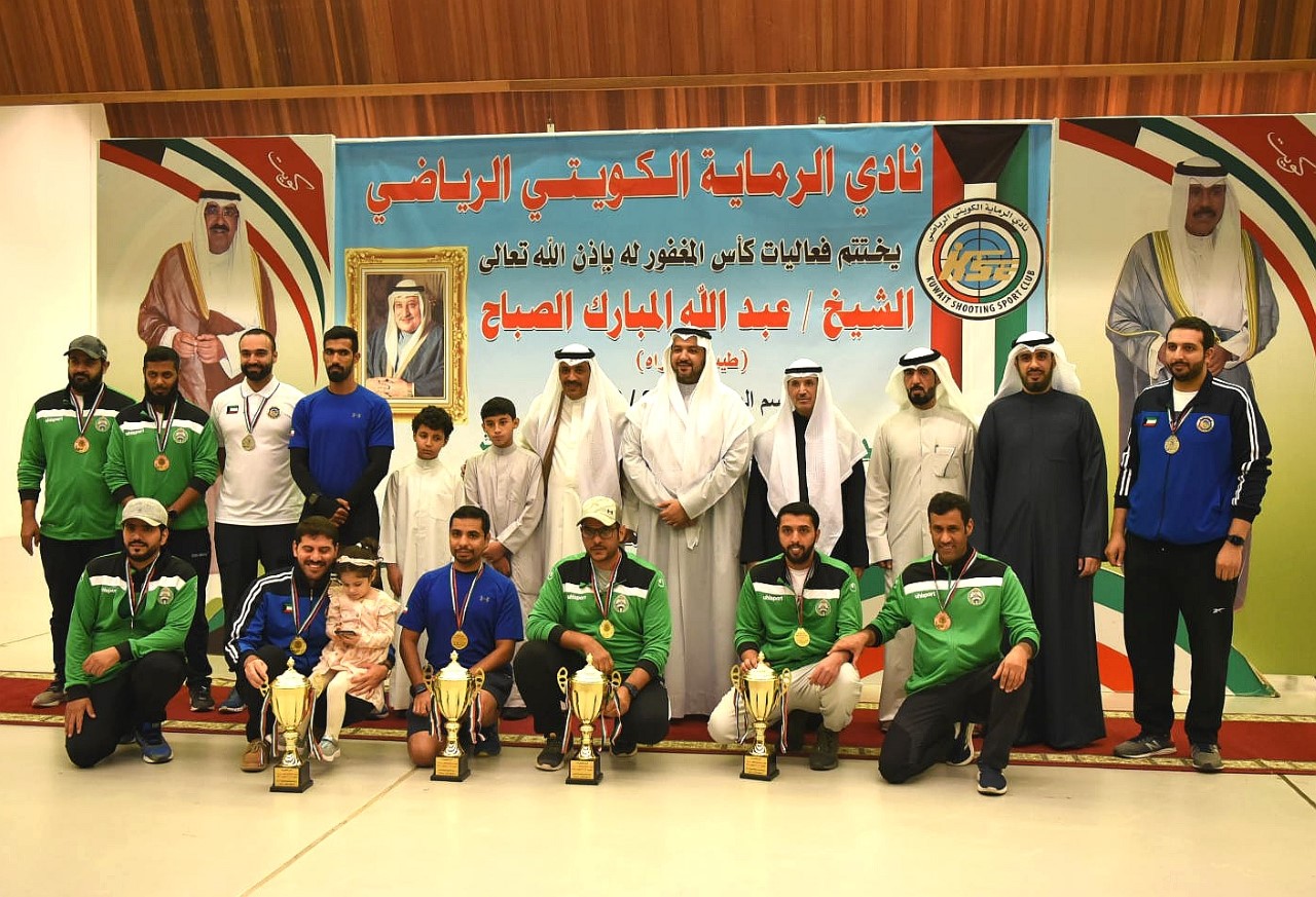 Group photo of winning shooters and representative of sponsor of the championship