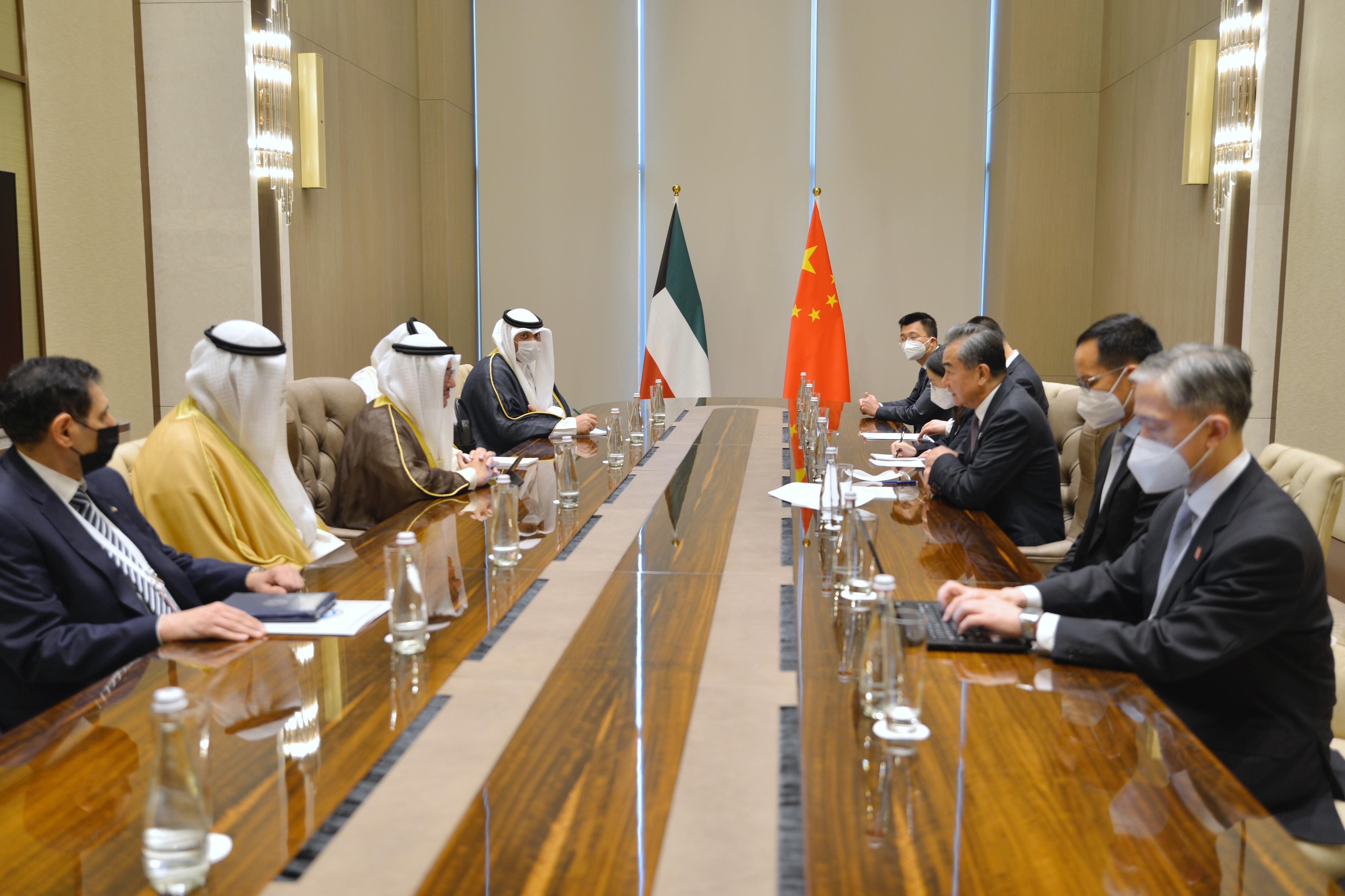 Foreign minister Sheikh Dr. Ahmad Nasser Al-Mohammad Al-Sabah meets with Chinese counterpart Wang Yi.