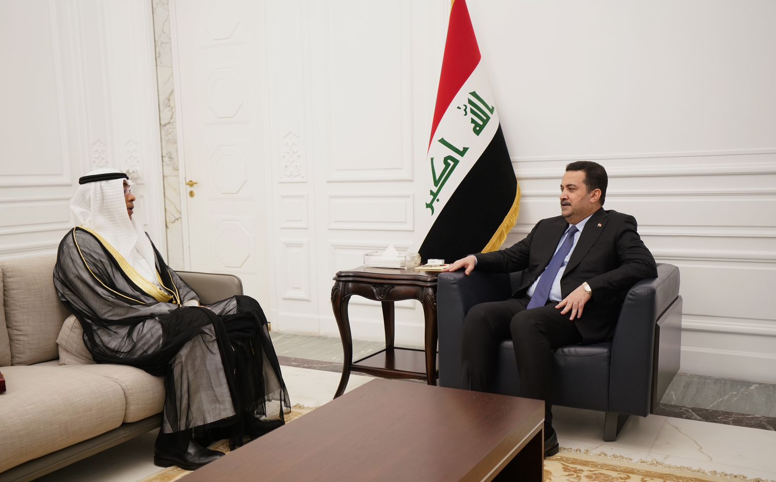 Iraqi Prime Minister Mohammad Al-Sudani with Kuwaiti Ambassador in Baghdad Tariq Al-Faraj