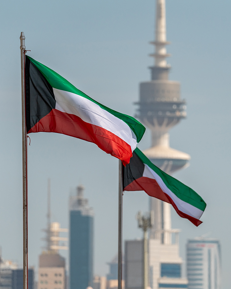 Kuwaiti flying flags marking national occasions