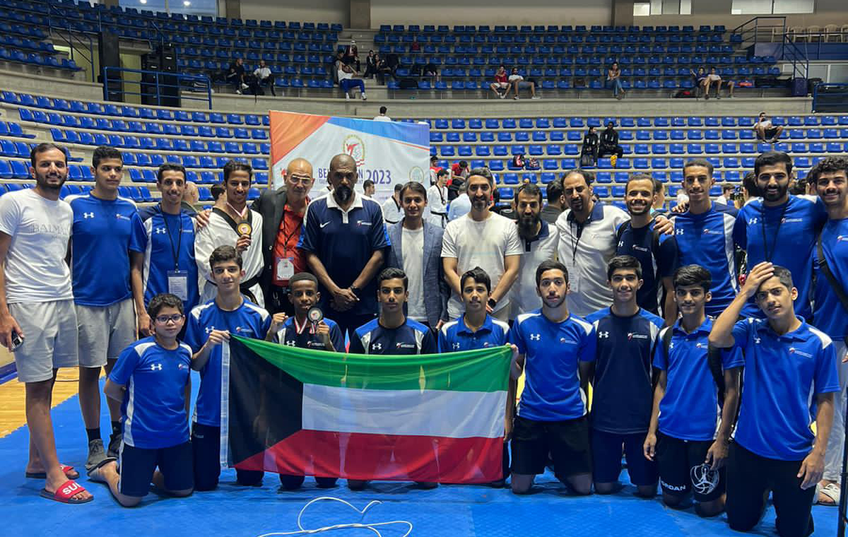 Members of Kuwait Taekwondo team with coaches