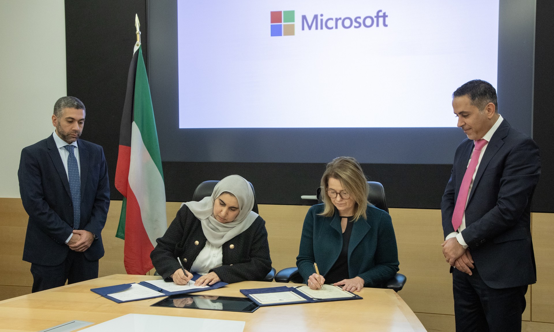 Kuwait's Finance Undersecretary Aseel Al-Menifi and Microsoft's Vice President for Public Sector Angela Heise signing a memorandum of understanding