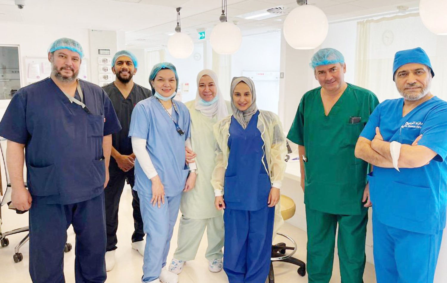 Dr. Hanan Al-Husseini with participants in the workshop and the team at the pregnancy and birth ward at Al-Jahra Hsopital