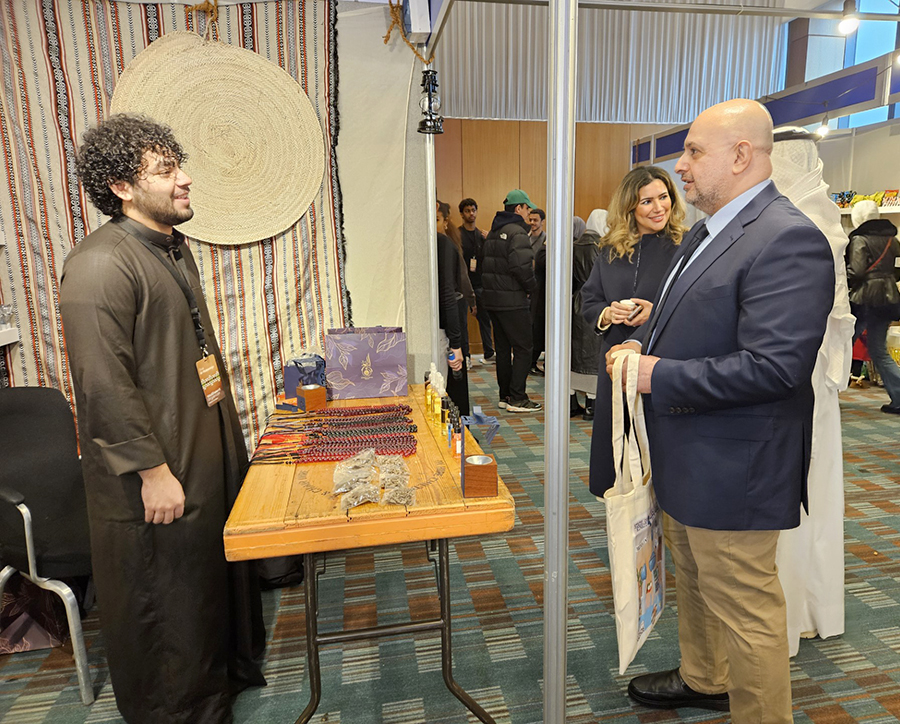 Ambassador Bader Al-Awadhi visiting a student's booth in Al-Mubarakiya Market event