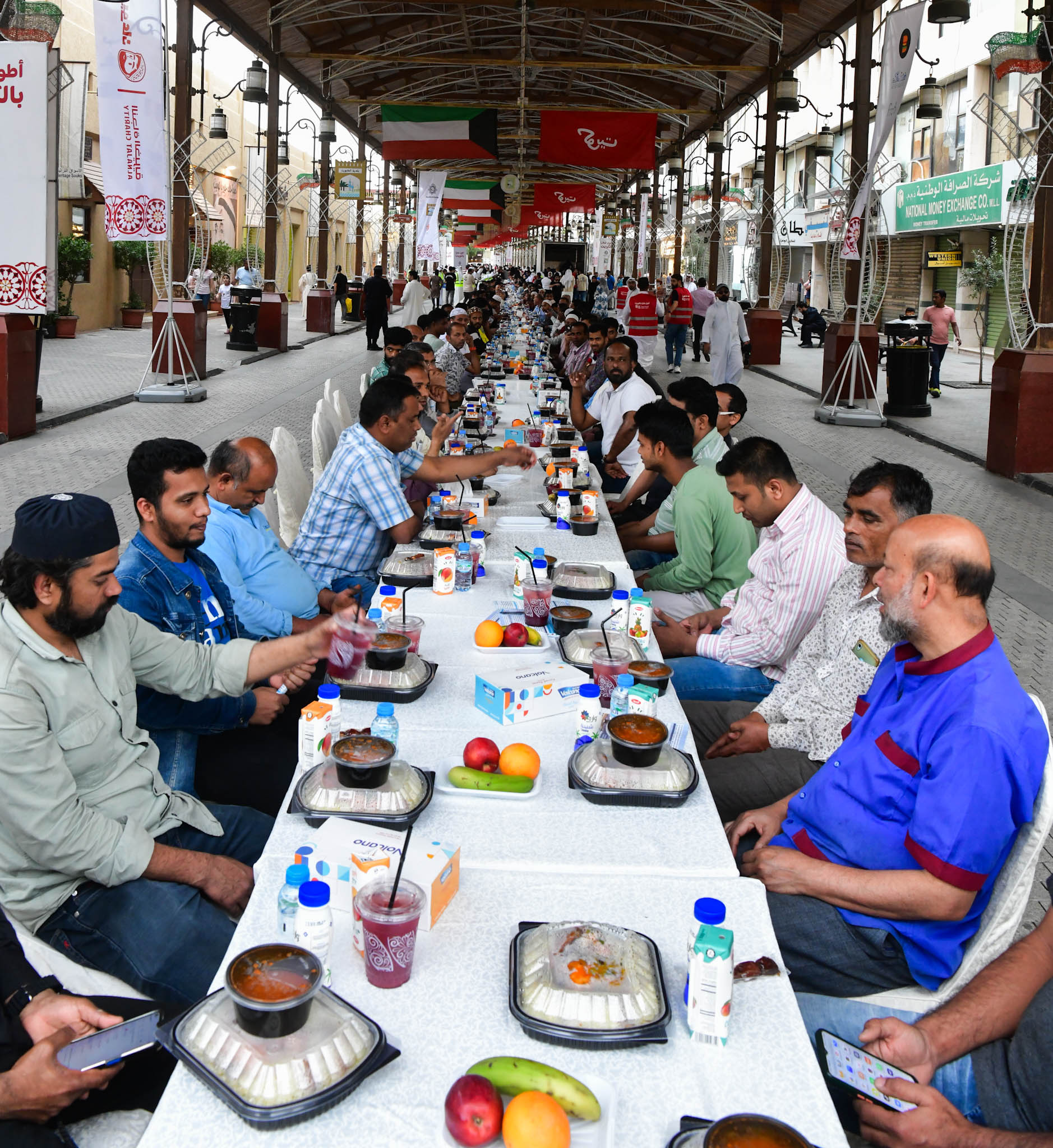 Iftar (fast-breaking) banquet in Al-Mubarakiya marketplace