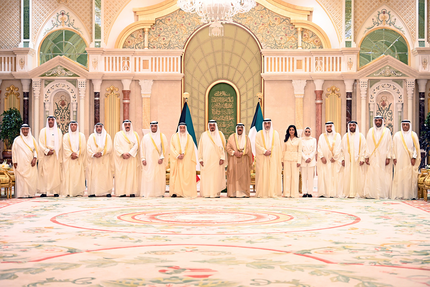 His Highness the Amir Sheikh Meshal Al-Ahmad Al-Jaber Al-Sabah in a group photo with His Highness the Prime Minister and the new Ministers after taking constitutional oath