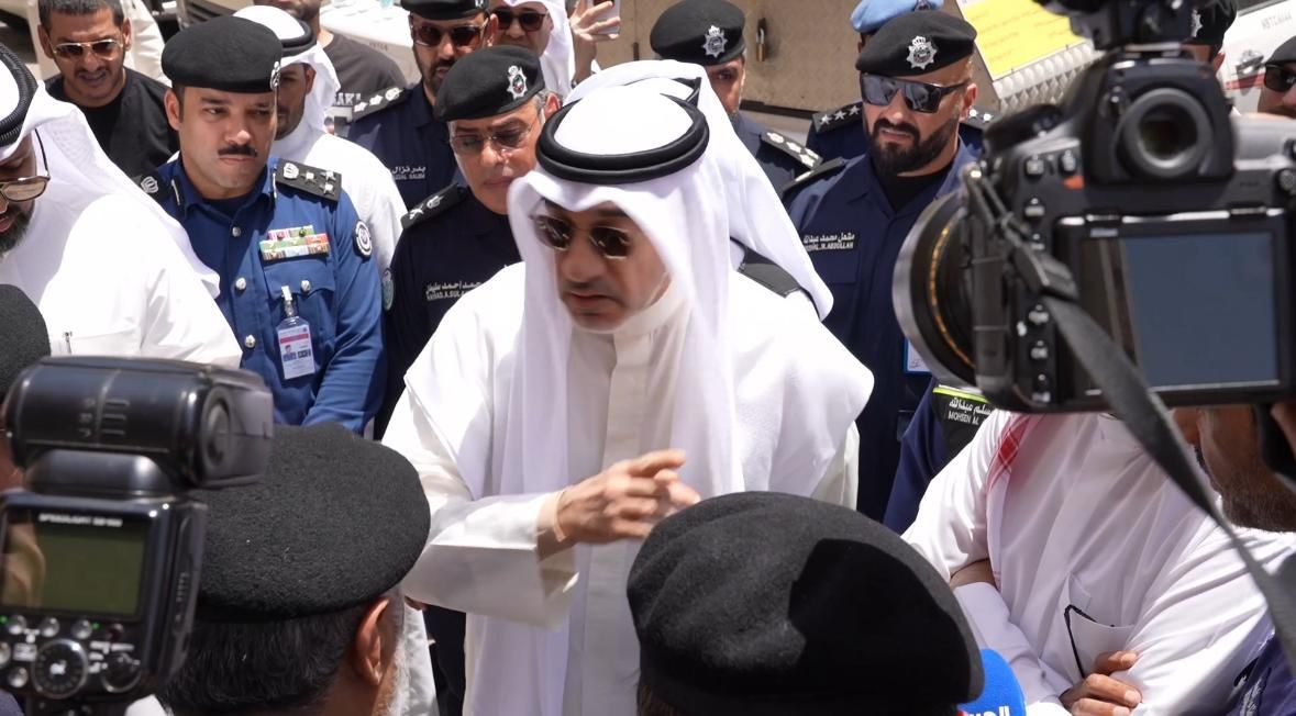 Defense Minister and Interior Minister Sheikh Fahad Yousef Saud Al-Sabah inspects the fire site