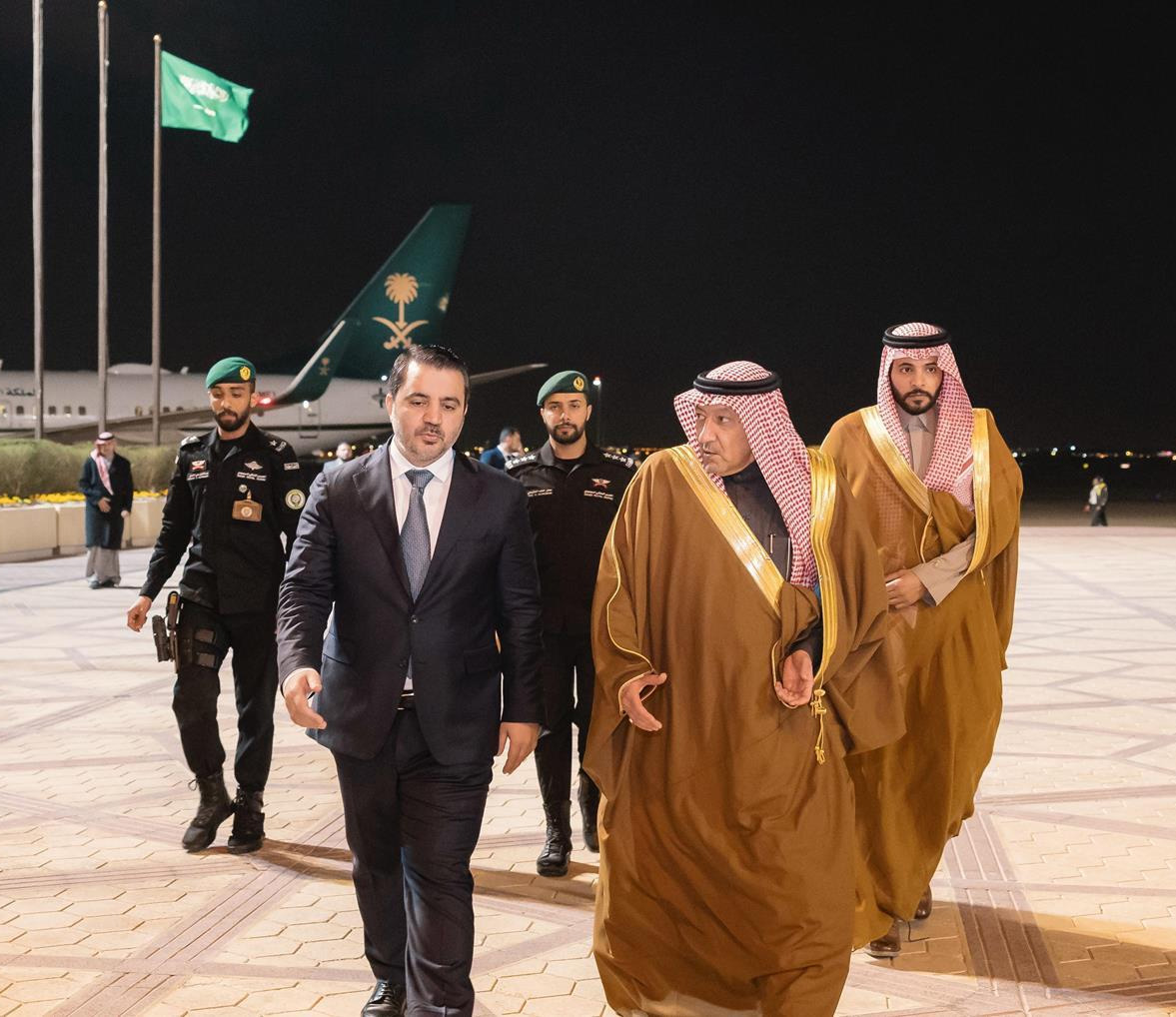 Syria's newly-appointed Foreign Minister Asaad Hassan Al-Shaybani with Saudi Deputy Foreign Minister Walid Al-Khreiji