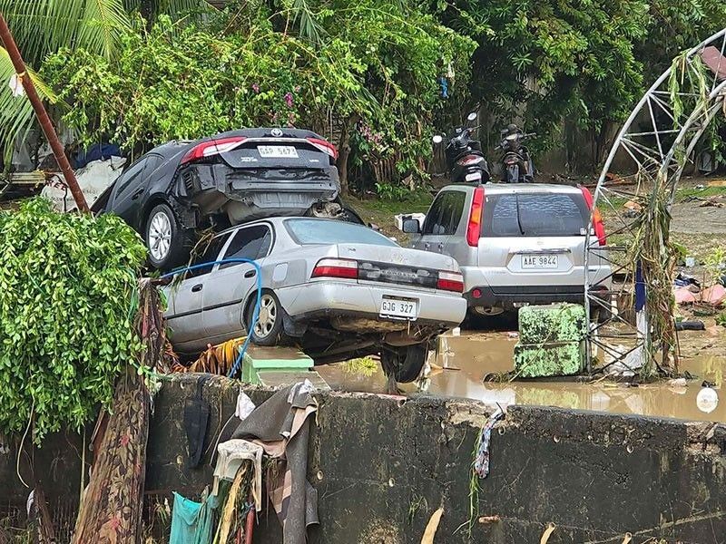 Several vehicles were damaged by severe flooding caused by Typhoon Kalmaighi in a residential complex in Cebu province, Philippines