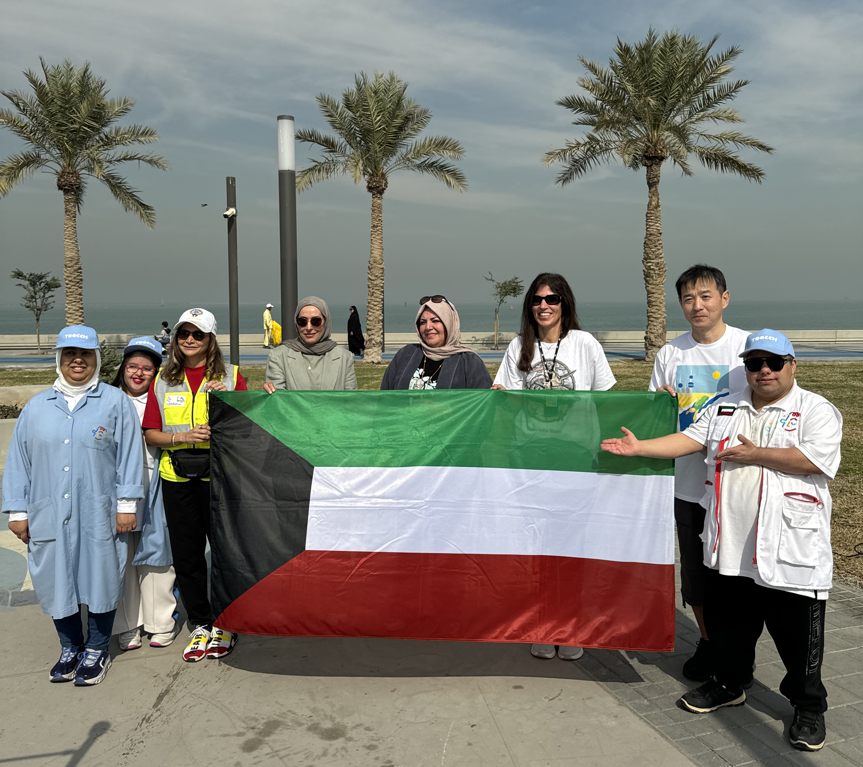 A group photo during the 26th edition of the annual "Operation Turtle" beach cleanup campaign at Shuwaikh Beach.