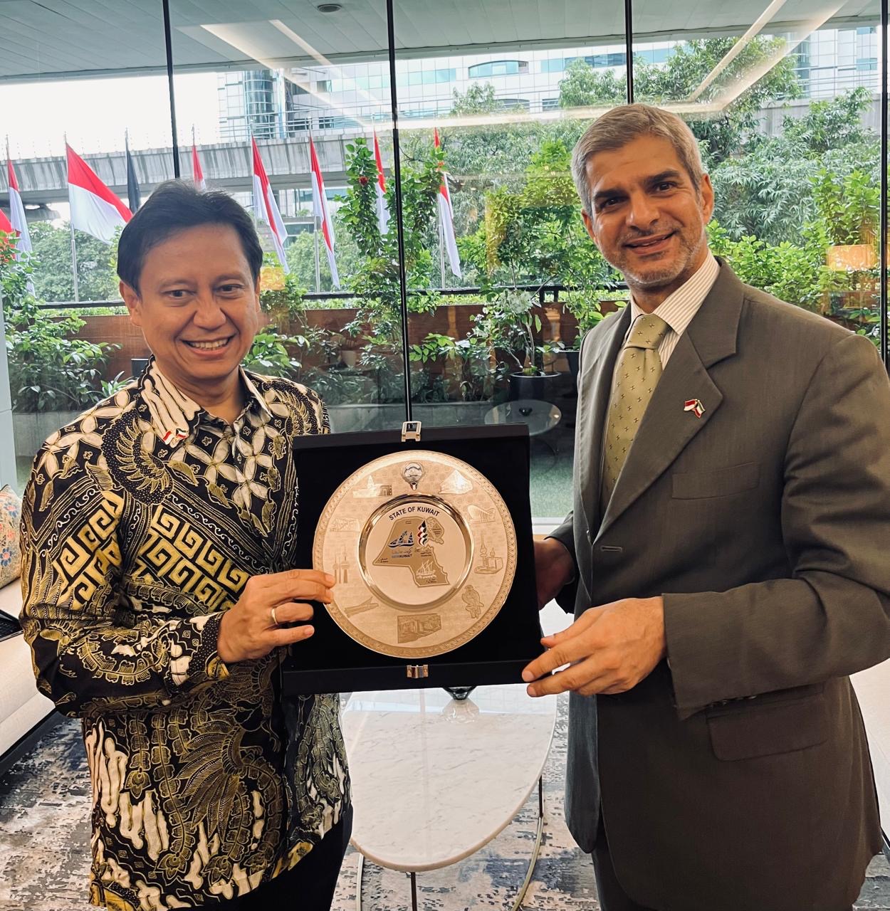 Kuwait's Ambassador to Indonesia Khaled Al-Yasin with Indonesian health minister Budi Gunadi Sadikin