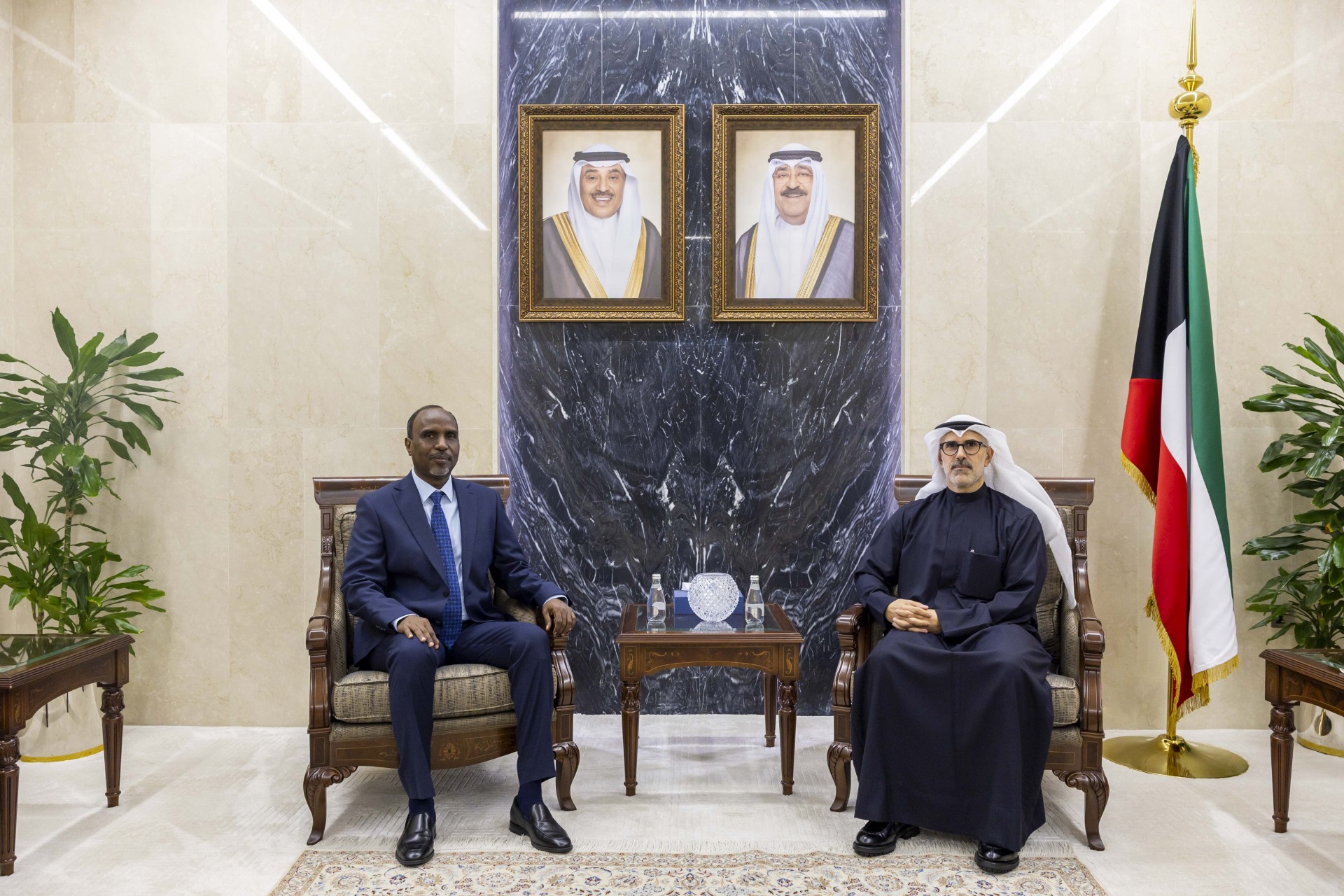 Kuwaiti Deputy Foreign Minister Sheikh Jarrah Jaber Al-Ahmad Al-Sabah and Djibouti's Ambassador to Kuwait Issa Khaireh Robleh