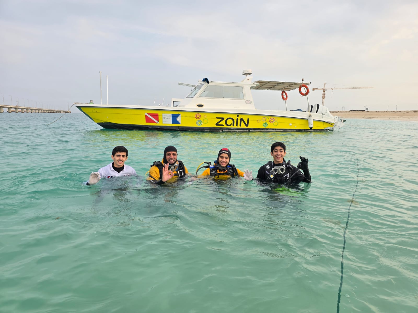 Kuwait Divers clean up beach marking the International Volunteer Day