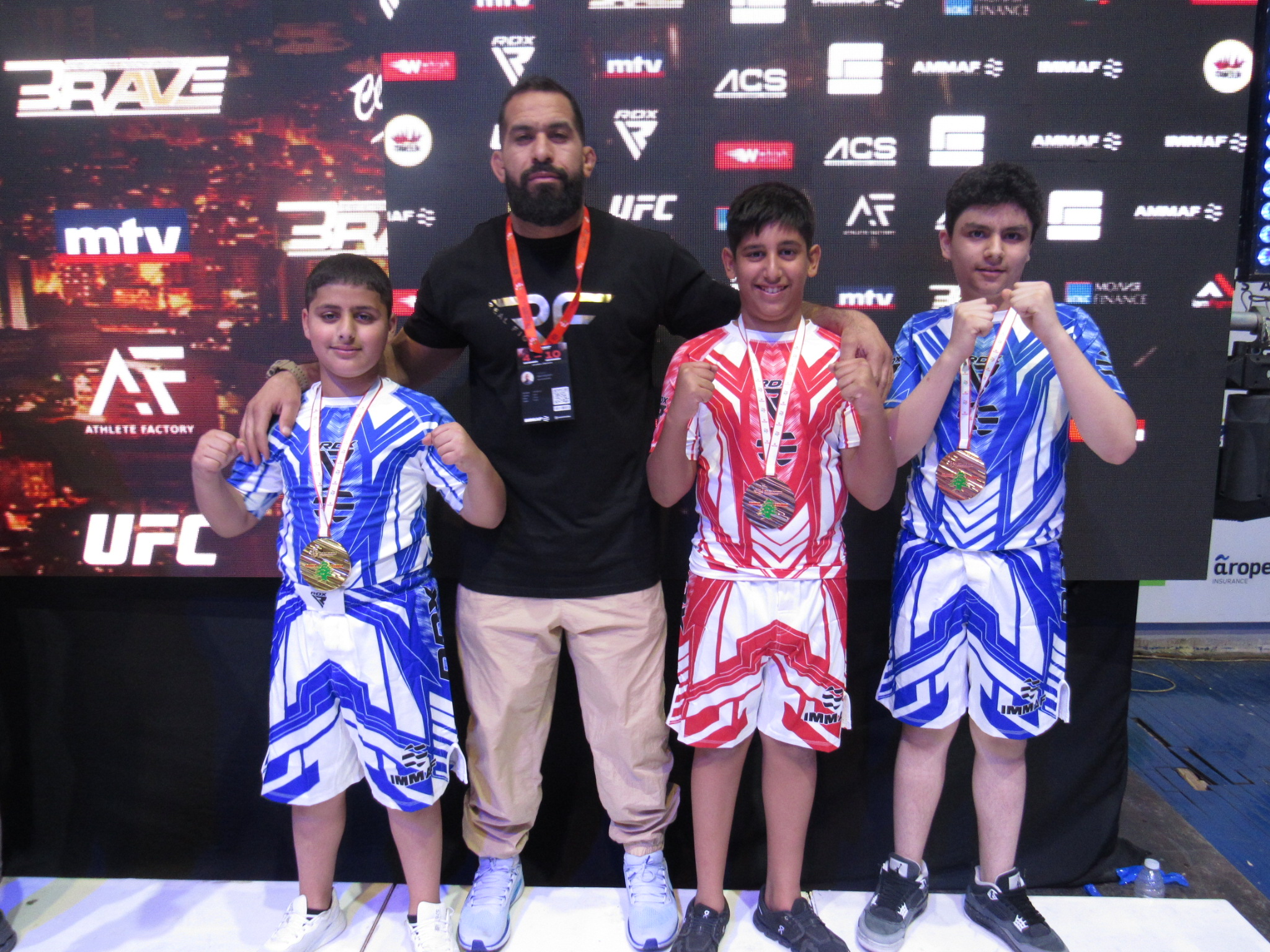 Kuwait's national team champions with the team's coach Osama Al-Saeedi