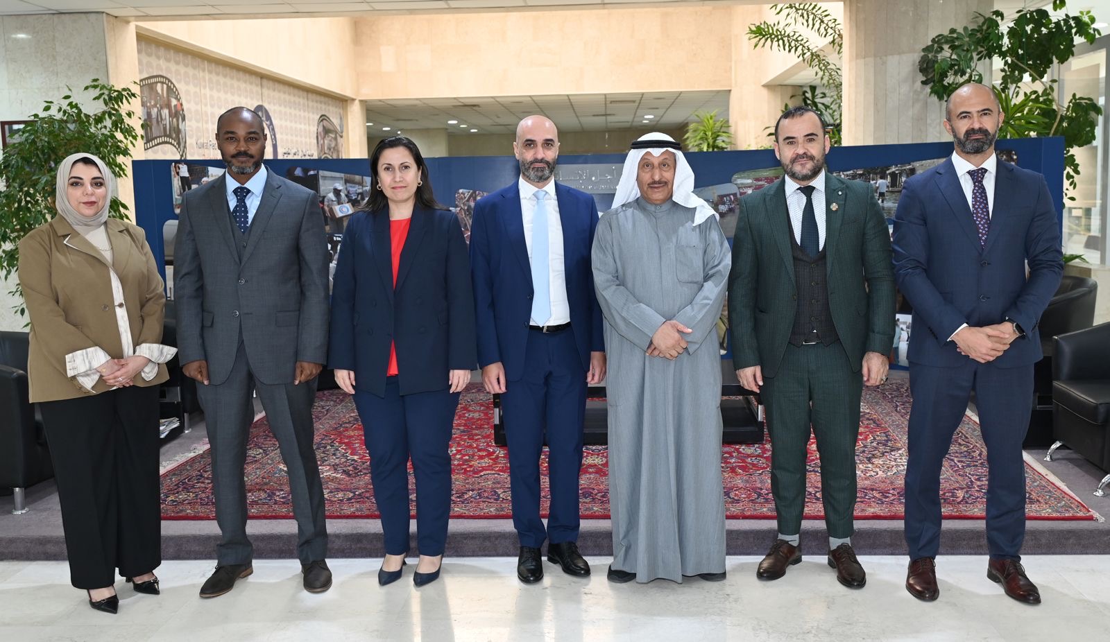 (KRCS) Chairman Khaled Al-Mughames with International Organization for Migration's (IOM) delegation